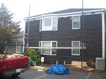 Installation of new white cedar shingles for law office in Chatham, MA